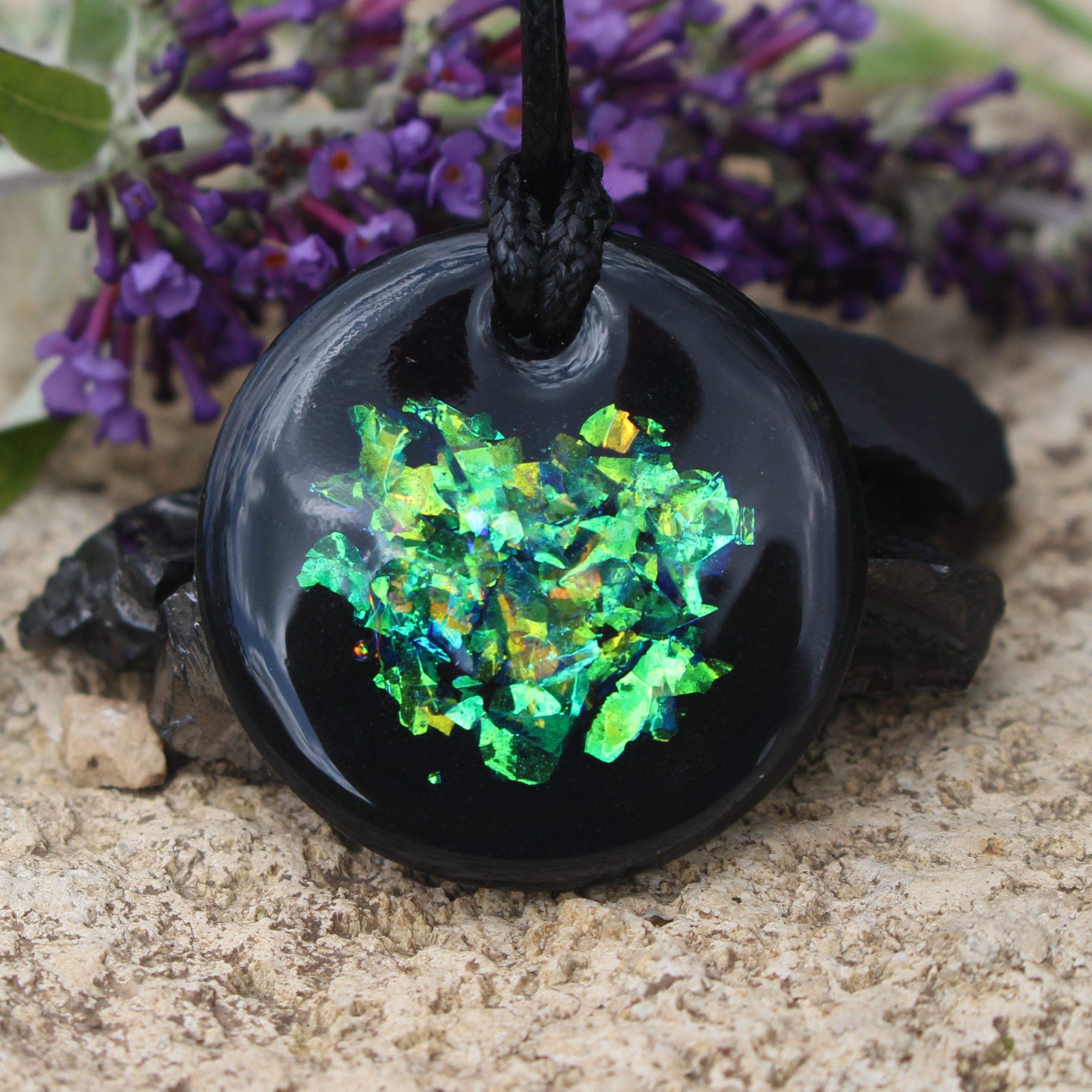 Shungite flat Solid Stone with Beautiful Unique Dichroic sparkle by Oraphim 35mm Style Pendant Polished with Oraphim silver activated shungite powder added to one side to expand the frequency range to be made bio-compatible to include wifi & 5G Vegan thong included Italian Tarnish Resistant Sterling Silver chain Upgrade is available here: (https://www.etsy.com/uk/Oraphim/listing/835279927/sterling-silver-chain-upgrade-to-your?utm_source=Copy&utm_medium=ListingManager&utm_campaign=Share&utm_term=so.lmsm&share_time=1615479266639) We have conducted human body electrical field kerlian photography experiments of our silver infused shungite which show the rapid beneficial change to the wearer Oraphim Study the work with shungite by Nancy L Hopkins, Regina Martino, Grigory Andrievsky & Nina Kolesnikova and her team who work in the medical setting environment treating patients with shungite.